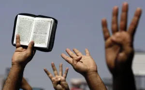 Egypt Prints: Supporters of Muslim Brotherhood and ousted Egyptian President Mursi hold up a Koran
