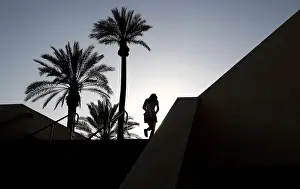 A tennis fan walks up the gangway leading into the main stadium at the Indian Wells