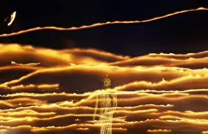 Thai Buddhists encircle a large Buddha statue during Vesak Day