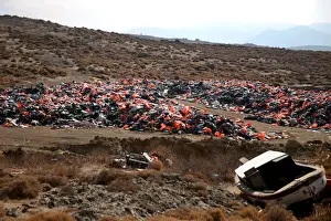 Migrant Prints: Thousands of lifejackets left by migrants and refugees are piled up at a garbage dump
