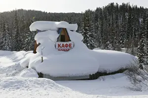 Prints of A tourist camp, covered with snow, is seen in the Ergaki nature park in the Western Sayan mountains in Krasnoyarsk Region, Russia February 15, 2018. The sign reads Cafe and overnight lodging' Russia Prints: A tourist camp is seen in the Ergaki nature park in Krasnoyarsk Region