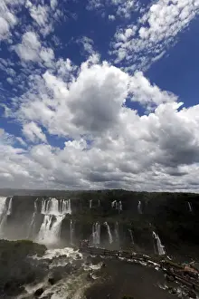 Landscapes Prints: Tourists look at the Iguazu Falls from an observation platform at the Iguazu National