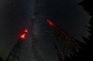 Environment Prints: A trace of the Perseid meteor is seen over telecommunication masts in Krasnoyarsk Region