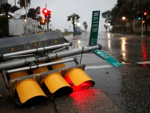 Storm Prints: Traffic lights lie on a street after being knocked down