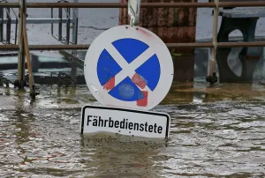 Weather Prints: A traffic sign is flooded by the river Rhine, in Linz