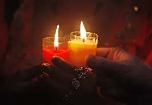 Transgender Pakistanis hold candles in commemoration of World AIDS Day in Karachi