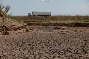 Argentina Prints: A truck passes by a dried-up creek bed in a drought-affected area near Chivilcoy