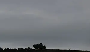 Mideast Prints: A Turkish armoured vehicle is driven along the Turkish-Syrian border in Hatay province