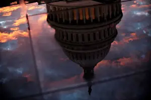 The U. S. Capitol dome is reflected in the glass skylight of the Capitol Visitor Center
