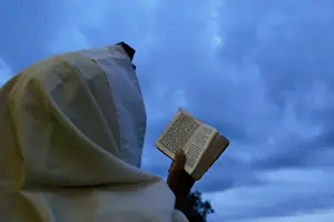 Ultra orthodox Jewish man prays close to the tomb of Rabbi Nachman of Breslov in