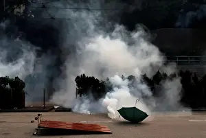 An umbrella lies down as anti-government protesters demonstrate in Admiralty district