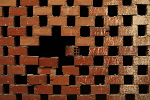 An unfinished brick wall is seen at a site where construction was halted after a lack An unfinished brick wall is seen at a site where construction was halted after a lack