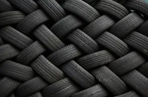 Used car tires form a pattern as they are seen stacked outside an automotive shop in East Dulwich Used car tires form a pattern as they are seen stacked outside an automotive shop in East Dulwich