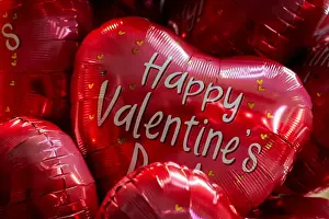 : Valentines Day balloons are displayed at a shop at the Eastern Market in Washington