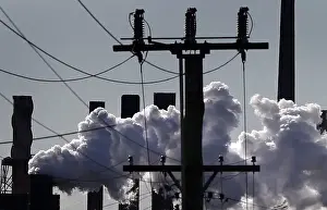 Vapour pours from a steel mill chimney in the industrial town of Port Kembla