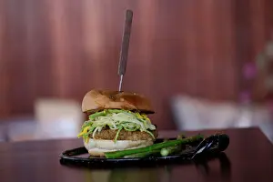 : Vegan oat and chickpeas hamburger is pictured at Tasty Beet Juicy