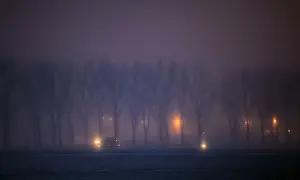 Weather Prints: Vehicles drive through fog on a frosty road near Dragos Voda village