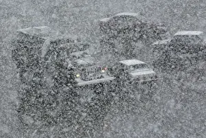 Prints of Vehicles drive along a road during a heavy snowfall in the Siberian town of Divnogorsk, Russia May 7, 2018. REUTERS/Ilya Naymushin Russia Prints: Vehicles drive along a road during a heavy snowfall in the Siberian town of Divnogorsk