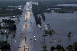 Storm Prints: Vehicles on Interstate 10 navigate through flood waters caused by Tropical Storm Harvey