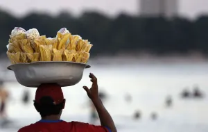 A vendor sells Amazon food next to the Negro River in Manaus A vendor sells Amazon food next to the Negro River in Manaus
