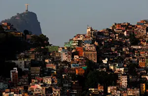 A view of the Rocinha slum with the Christ the Redeemer statue in the background