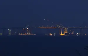 : A view shows a bridge, which is constructed to connect the Russian mainland with
