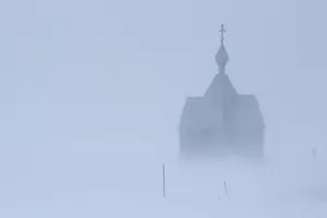 Prints of A view shows a church during a heavy snowfall in a settlement on the Pechora Sea island of Kolguyev in Nenets Autonomous District, Russia February 28, 2018. REUTERS/Sergei Karpukhin Russia Prints: A view shows a church during a heavy snowfall in a settlement on the Pechora Sea island