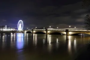 France Prints: A view shows the Pont de la Concorde bridge, the Grande Roue de Paris