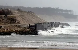 France Prints: A view shows sea walls on the beach front to protect damaged sand dunes due to