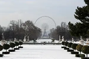 : A view shows the snow-covered Tuileries Garden and the giant Ferris wheel in Paris as