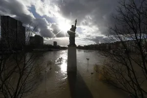 France Prints: A view shows the Statue of Liberty replica and flooded banks of the River Seine after