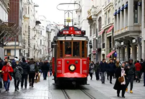 A vintage tram runs along the main shopping and pedestrian street of Istiklal in central