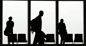 Abstract Prints: Visitors is silhouetted against a cloudy sky on the observation deck of a skyscraper