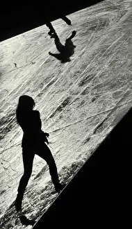 Shadow Prints: Visitors skate at the Tower of London ice rink in London