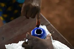 New Prints: A voters finger is marked with ink at a polling station during a presidential run-off in
