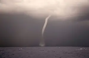 Migrant Prints: A waterspout is seen from the German NGO Sea-Eye migrant rescue ship Alan Kurdi as it