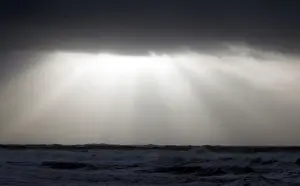 Waves break along Frances Atlantic coastline at sunset in Lacanau
