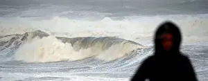 Waves break along Frances Atlantic coastline at sunset in Lacanau
