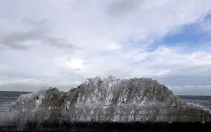 Images Dated 2014 January: Waves crash against the coastal wall in the village of Carnlough as high tides