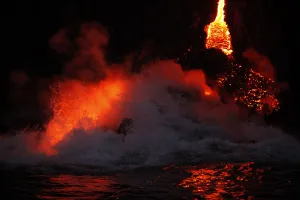 Volcano Prints: Waves crash over lava as it flows into the ocean near Volcanoes National Park in Kalapana