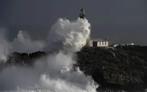 Weather Prints: Waves crash on the lighthouse of La Isla del Mouro in the port town of Santander in