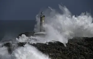 Weather Prints: Waves crash on the lighthouse of La Isla del Mouro in the port town of Santander