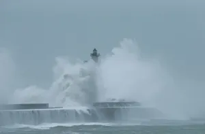 Weather Prints: Waves crash against a lighthouse during a windy day in Boulogne-sur-Mer