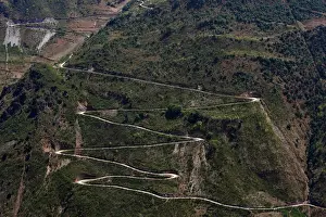 Prints of A mountain road is seen in an ethnic Lisu village in Luzhang township of Nujiang Lisu Autonomous Prefecture in Yunnan province, China, March 28, 2018 China Prints: The Wider Image: Chinas Lisu aim to save crossbow culture