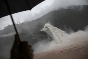 Prints of Water is released as heavy rain falls at a massive Pubugou Dam on the Dadu river, a tributary of the Yangtze River in Hanyuan County of Sichuan province, China, August 3, 2018 China Prints: The Wider Image: Dam nation: China crackdown spares big hydro projects