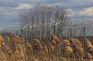 Election Prints: The Wider Image: In Hungary, one fence comes down, another goes up
