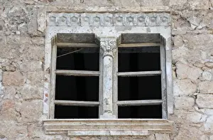 : Window of a historic building, that was damaged during a three-year conflict