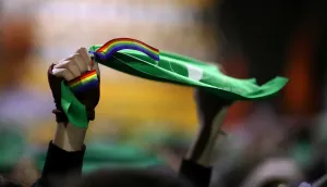 A woman holds up a green handkerchief during a demonstration in favour of legalising A woman holds up a green handkerchief during a demonstration in favour of legalising