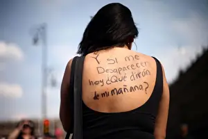 Mexico Prints: A woman takes part in a demonstration demanding justice for the female victims of