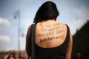 Mexico Prints: A woman takes part in a demonstration demanding justice for the female victims of